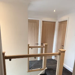 Oak and glass landing balustrade with oak internal doors