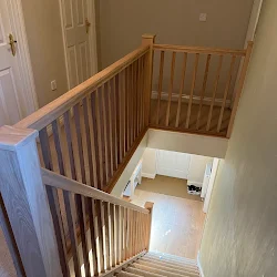 Oak staircase and landing balustrade fitted in a Wellingborough home